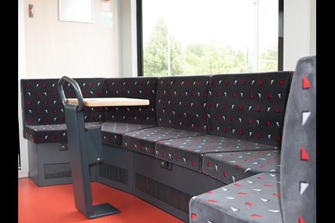 The majority of seats have tables for laptops, and there is a corner seat for groups travelling together.